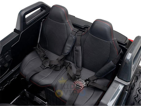 The vehicles rear holds two black bucket seats with red stitching and safety harnesses, enhancing its rugged design. Ideal for adventurers, this Kids XXL Ride On offers a minimalistic black interior like the Black 24V/4X4 Dune Buggy Ride On UTV, featuring durable rubber wheels.