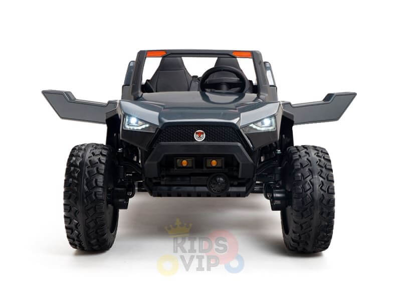 The Black 24V/4X4 Dune Buggy Ride On UTV mimics a rugged off-road vehicle with its angular design, open seating, distinctive headlights, and large rubber wheels. Its perfect for mini explorers ready to tackle any terrain.