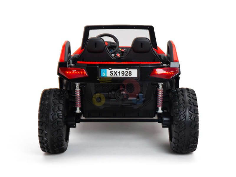 The Red 24V/4X4 Dune Buggy Ride On UTV with rubber wheels and RC features rear view striking red and black design, large tires, visible steering wheel, SX1928 plate, red tail lights on white backdrop for thrilling adventures.