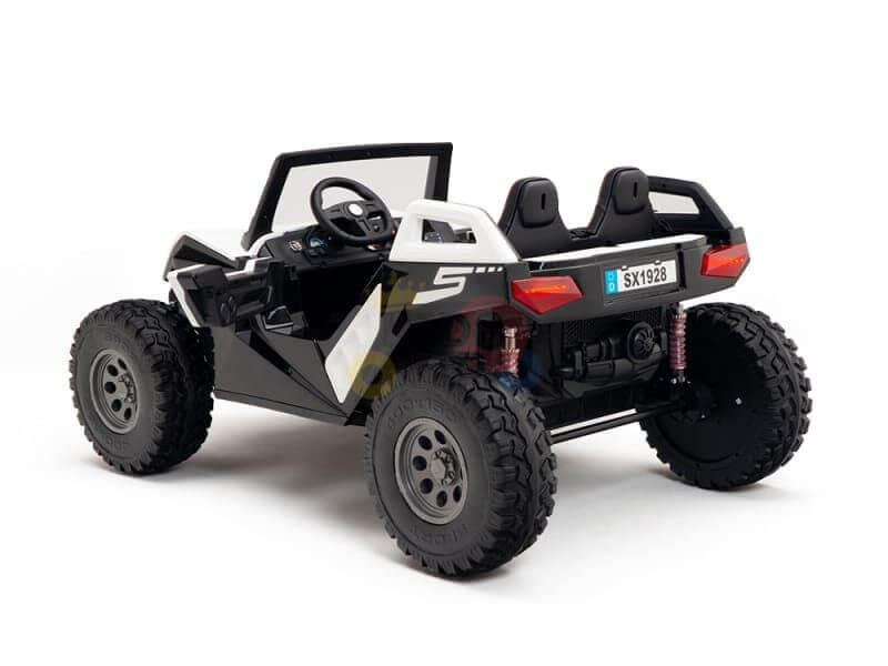 A black-and-white Kids XXL Edition ride-on UTV toy features rubber wheels, two black bucket seats, a roll cage, and realistic elements such as a front grille and rear bumper. It mimics the White 24V/4X4 Dune Buggy Ride On UTV and is set against a plain white background.