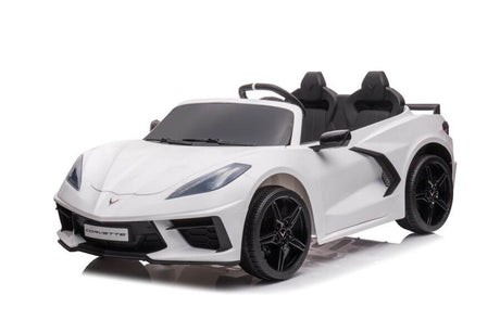 The Kids Premium 24V White Corvette C8 Ride-On features EVA wheels, black accents, leather seats for two, sharp headlights, a small front logo, detailed rims, and a sleek design.