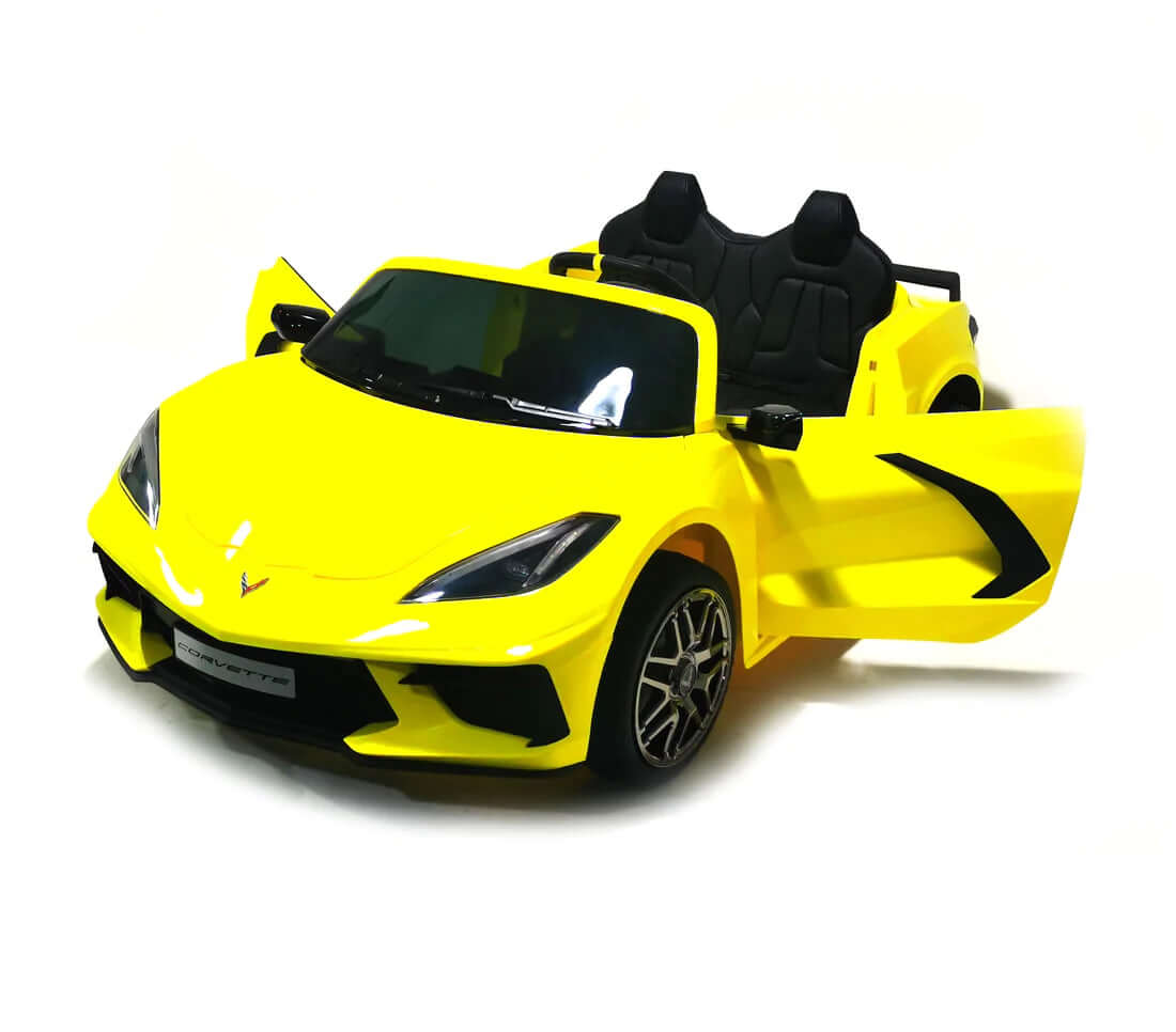 The Kids Premium 24V Yellow Corvette C8 Dual-Seater is displayed, featuring a sleek, sporty design with leather seats and detailed EVA wheels. With an open drivers door and black interior on a pristine white background, it highlights its stylish allure and intricate rims.