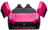 The pink XXL 24V Maserati MC20 ride-on car features upward-opening doors, illuminated headlights, and the iconic Maserati logo on the grille. This luxury two-seater includes RC control, leather seats, and rubber tires for an authentic experience.