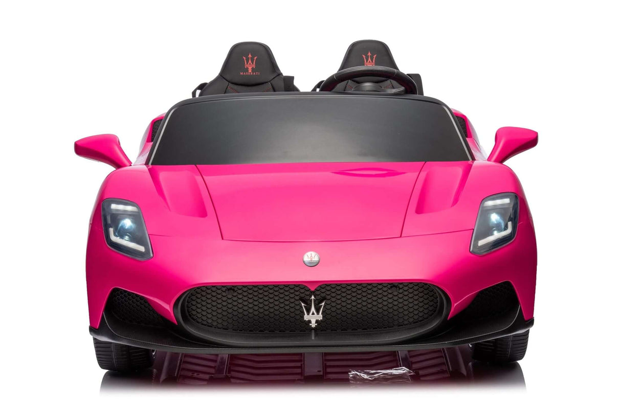 The Experience Luxury: Pink XXL 24V/105W Maserati MC20 toy features glowing headlights, a sleek black grille with the iconic logo, dual embroidered logo seats for luxury appeal, and a detailed design with leather seats and rubber tires for realistic childrens playtime adventures.