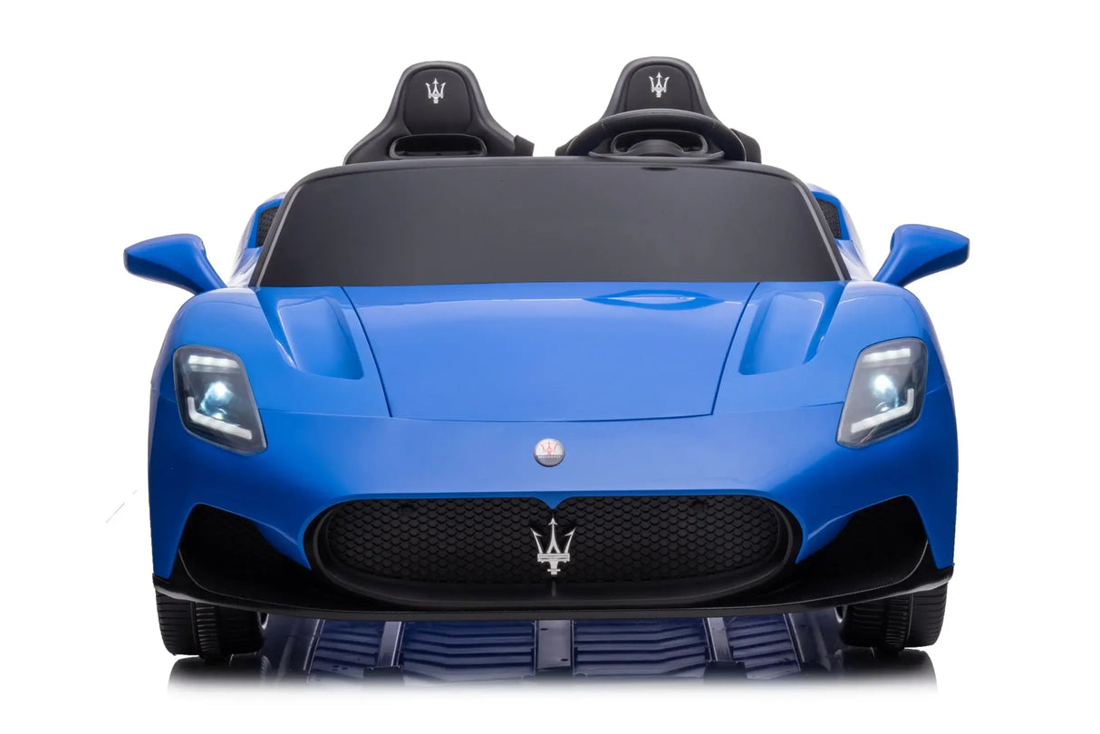 Front view of the blue XXL 24V/105W Maserati MC20 childrens toy car, with illuminated headlights and a trident logo on the front grille. This luxury ride-on features leather seats, rubber tires, and an RC. The premium 2-seater is elegantly positioned on a white background.