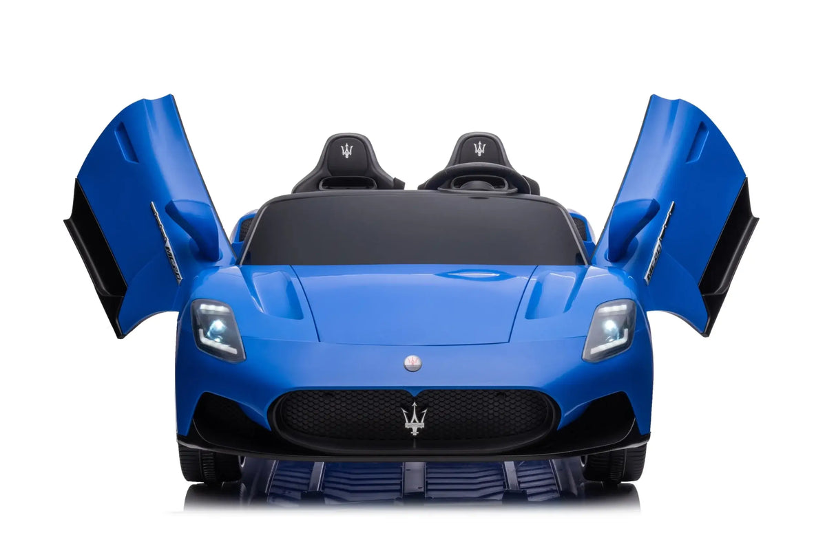 A blue Maserati MC20 XXL 24V/105W toy car with butterfly doors, premium 2-seater design, leather seats, rubber tires, and iconic trident logo on the grille creates the ultimate luxury ride-on against a plain white background.