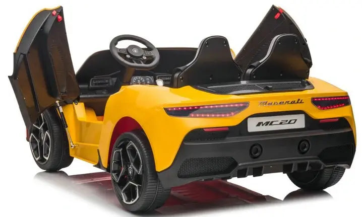 The yellow XXL 24V Maserati MC20 toy car is a luxury ride-on with RC, featuring leather seats, rubber tires, open vertical doors, a black interior, an MC20 license plate, headlights, a steering wheel, and rearview mirrors for an authentic driving experience.