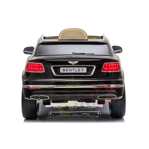 The image displays a rear view of the Black Licensed Bentley Bentayga Complete Edition 12V Kids Ride On Car with RC. It features illuminated red taillights, Bentley branding, detailed features like leather seats, and a visible exhaust, offering parental remote control for safety.