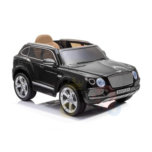 The Black Licensed Bentley Bentayga Complete Edition 12V Kids Ride On Car With RC boasts a sleek black finish, silver rims, and a tan leather seat interior. With detailed headlights and the iconic Bentley grille, it mirrors its real-life counterparts grandeur.