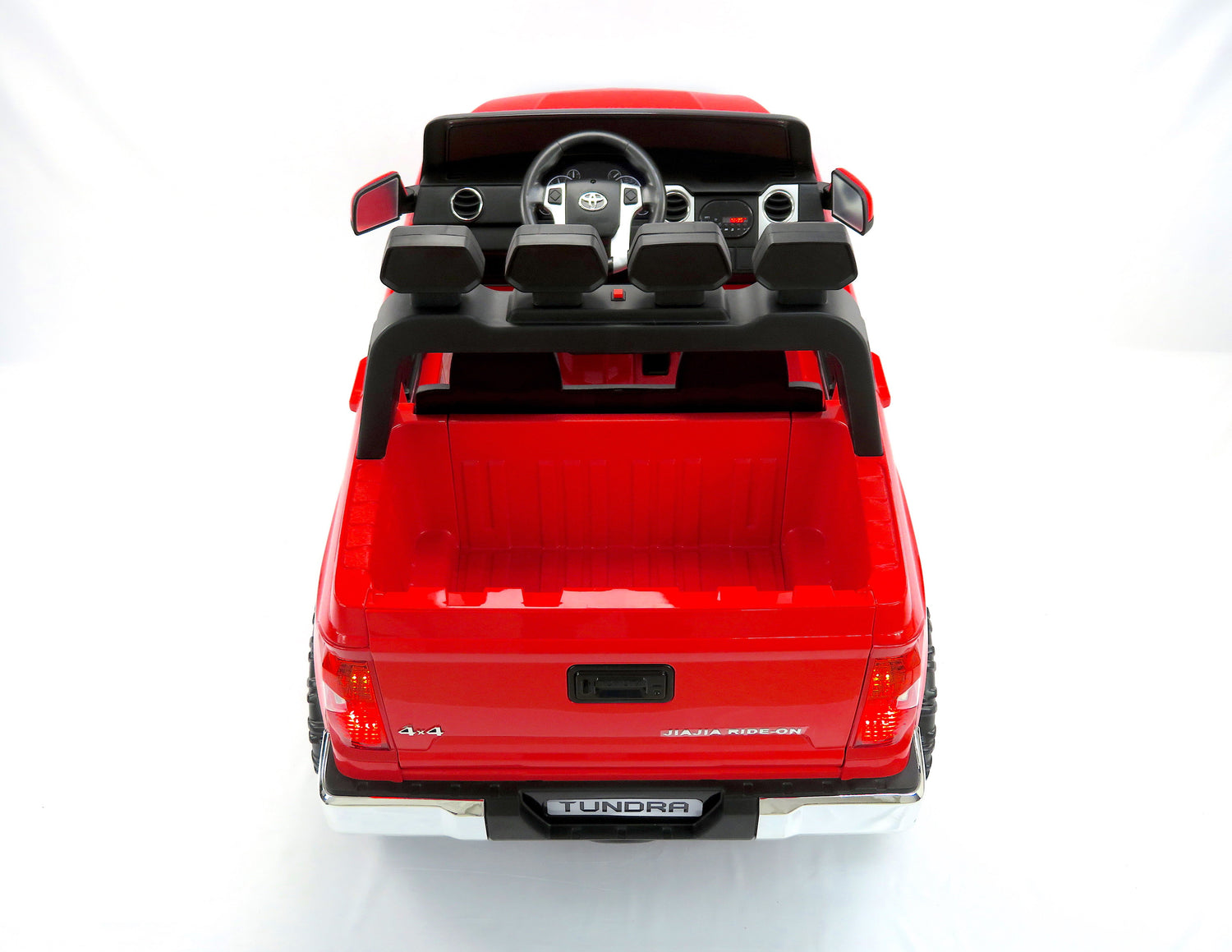 From a high angle, the Red 12v Licensed Toyota Tundra 2-Seater Kids Ride On Truck captivates with its detailed interior and visible steering wheel. The Upgraded Eva Edition stands out brilliantly against a plain white background.