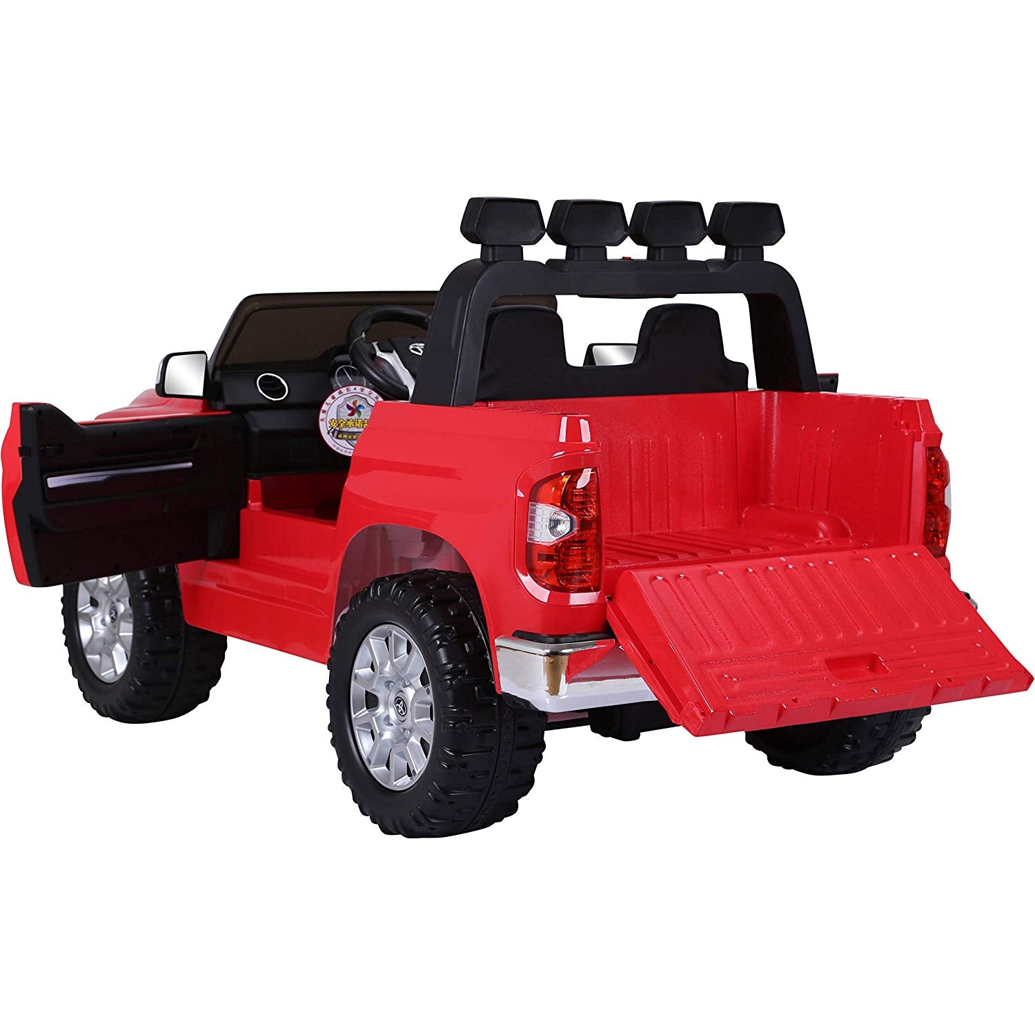 The Red 12v Licensed Toyota Tundra Kids Ride On Truck features a pickup bed with the tailgate down, silver wheels, and a black 2-seater interior. An open drivers door reveals the steering wheel while four roof lights adorn this RC toy truck.