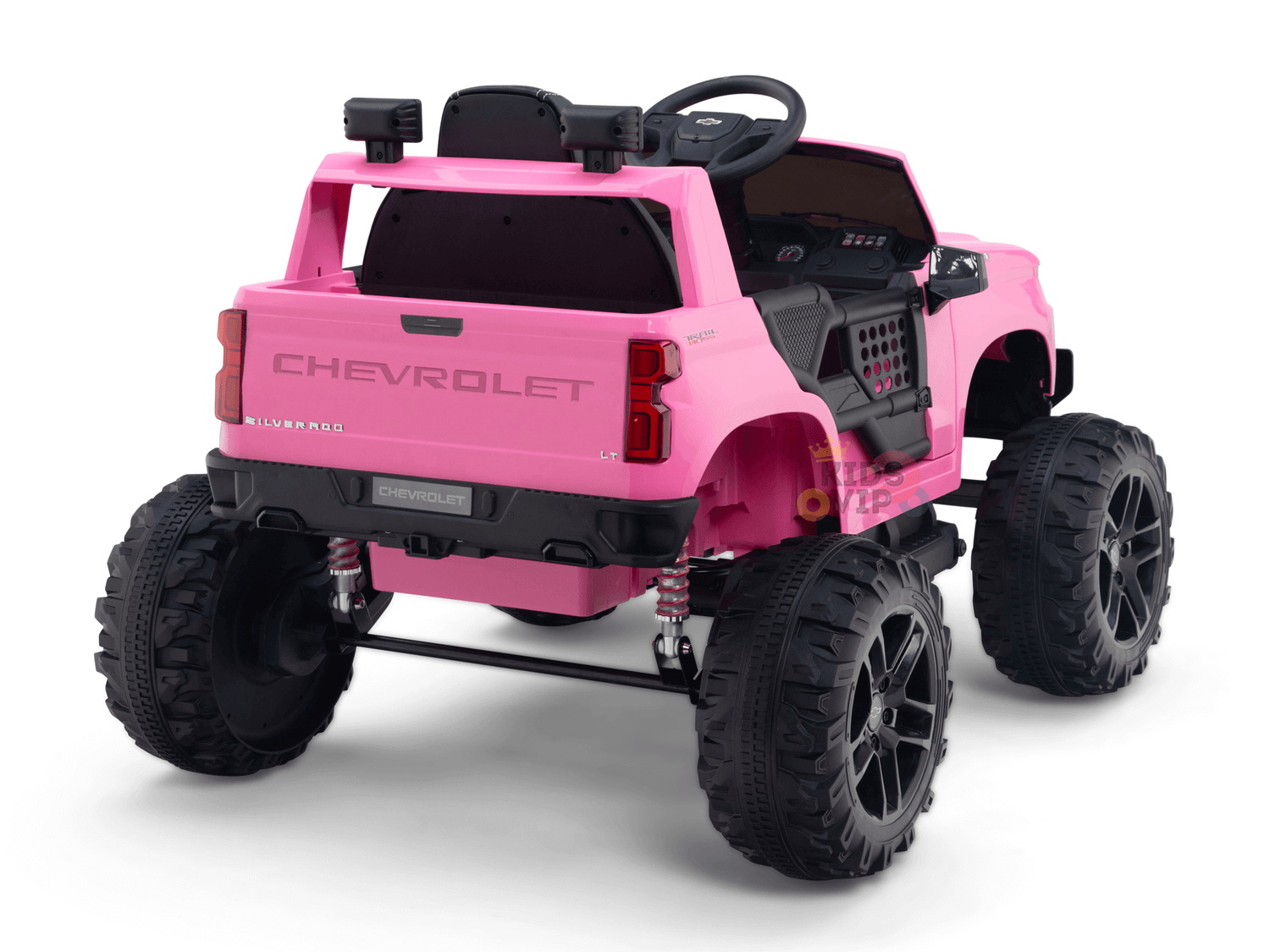 The Pink 24V Chevrolet Silverado Kids Licensed 1 Seater Ride On Lifted Truck, featuring oversized black wheels, steering wheel, and detailed interior, is a miniature masterpiece for kids. It offers an elevated thrilling view from behind.