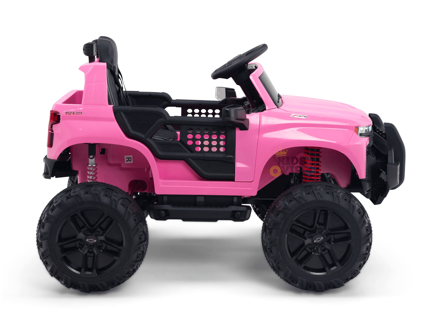 The Pink 24V Chevrolet Silverado Kids Licensed 1 Seater Ride On Lifted Truck features large black wheels, an open cabin, and a steering wheel. It has realistic details and raised suspension, set against a plain white background.