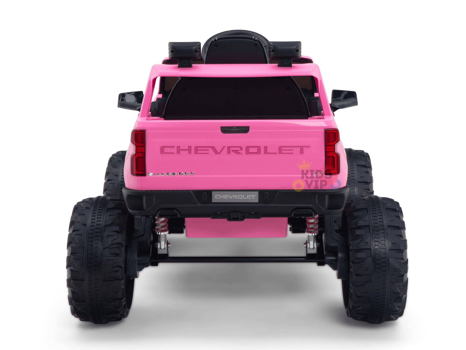 A pink 24V Chevrolet Silverado Kids Licensed 1 Seater Ride On Lifted Truck features large black tires, CHEVROLET emblems on the tailgate, and a rear-mounted spare tire, capturing adventure in a vibrant ride.