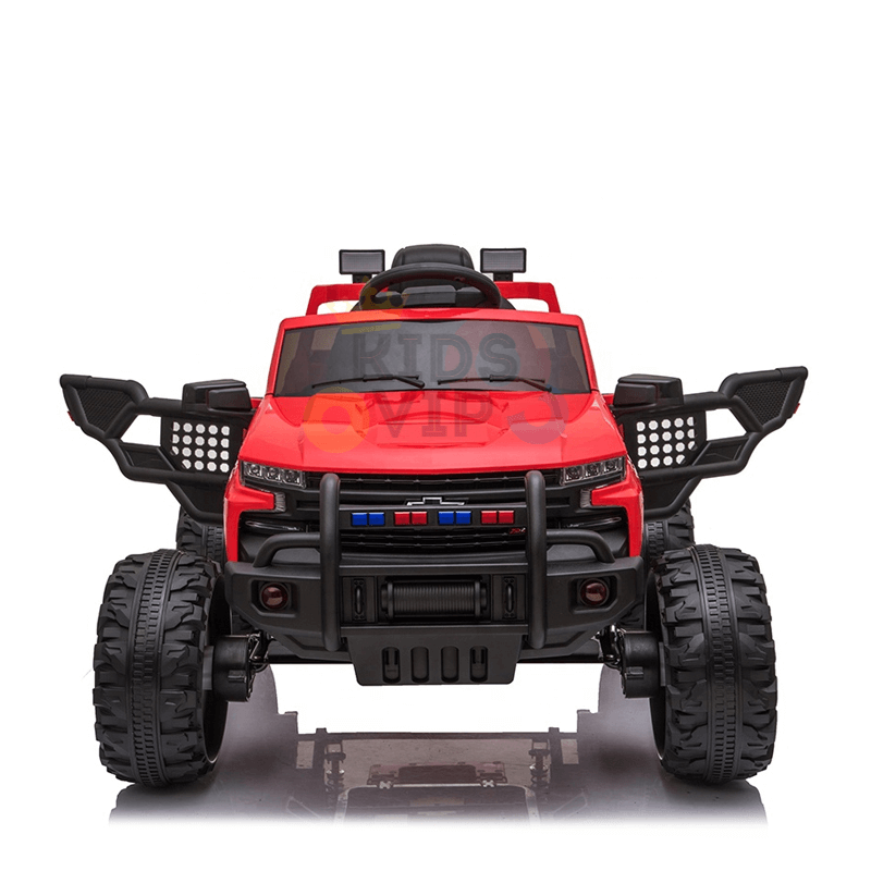 The Red 24V Chevrolet Silverado Kids Licensed 1 Seater Ride On Lifted Truck features oversized wheels, black tires, side mirrors, and a front bumper with grille and LED-like lights for a rugged off-road look, against a plain white backdrop.