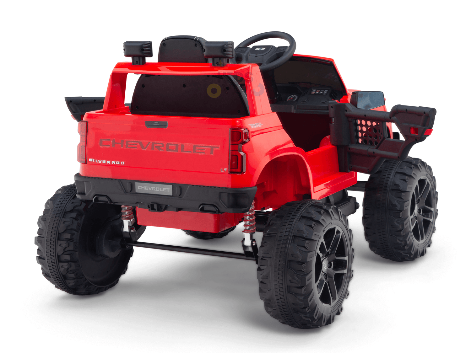 The Red 24V Chevrolet Silverado Kids Licensed 1 Seater Ride On Lifted Truck with Remote has large black wheels, a steering wheel, a detailed interior, and Chevrolet branding on the tailgate. It is pictured against a plain white background.
