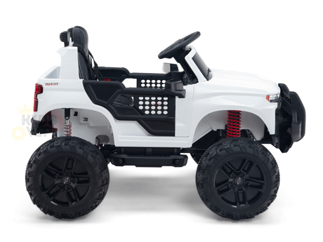 The White 24V Chevrolet Silverado Kids Licensed 1 Seater Ride On Lifted Truck features oversized black wheels, vibrant red suspension springs, an open cabin, and black side rails. Styled like a rugged off-road vehicle, it includes a steering wheel and comes with a remote control.