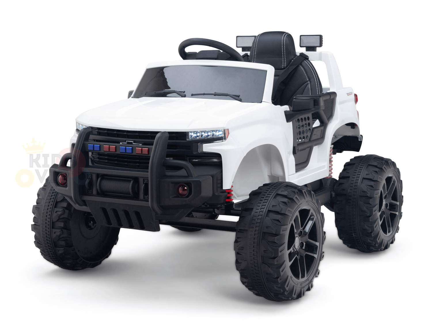 The White 24V Chevrolet Silverado Kids Licensed 1 Seater Ride On Lifted Truck features a detailed interior, oversized wheels, and a rugged front bumper. It mimics an off-road vehicle with a realistic steering wheel and red and blue lights on the front grille.