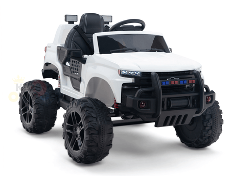 The White 24V Chevrolet Silverado Kids Licensed Ride-On Truck features an off-road design with oversized wheels, a steering wheel, front lights, and a protective grill. This one-seater offers a realistic mini Chevrolet Silverado experience for adventurous young drivers.
