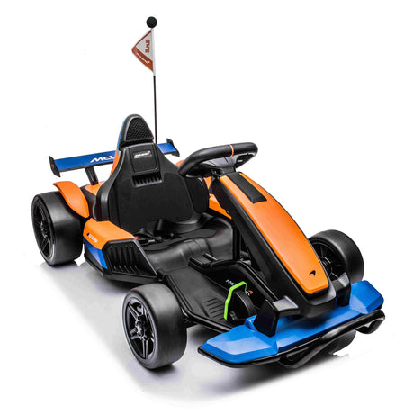 The Orange 24V Official Complete Edition McLaren Super Drifting Go-Kart features an aerodynamic design, vibrant orange and blue accents, a comfortable seat, rear flag, black tires, and a detailed steering wheel for thrilling drifting moments.