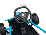 Close-up of the Blue 24V Sport Challenger Outdoor Drifting Kids Go Karts steering wheel with buttons. The kart has a black seat and floor, is powered by 24V motors, and features a cartoon bird logo on the wheel against a white background.