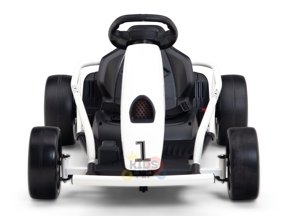 A front view of the 24V Sport Challenger Outdoor Drifting Kids Go Kart shows its sleek white body, black seat, and sturdy black tires. The prominently displayed steering wheel and 1 Kids logo on the bumper make it perfect for young racers seeking adventure.