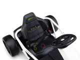 Close-up of a black and white 24v Sport Challenger Outdoor Drifting Kids Go Kart with steering wheel, single seat/seatbelt, and GoKart on headrest. Its sleek design features large black tires, perfect for kids to drift in style on any track.