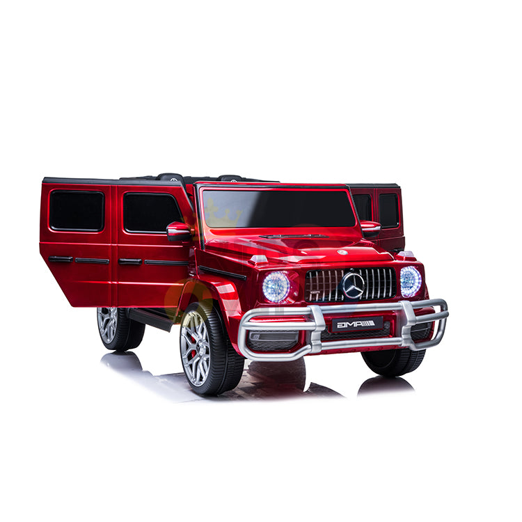 The 2 Seats 4x4 Official Mercedes Benz G63 Complete Edition is a red kids ride-on car with RC, featuring open doors, a shiny finish, bright LED headlights, chrome details, and a bold grille. It runs on a 24V battery and is set against a white background.
