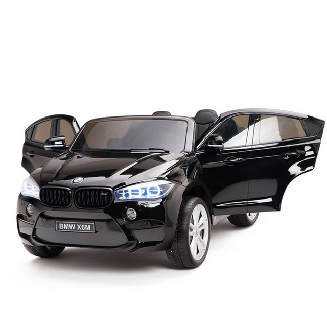 The Black 12V Licensed XXL BMW X6 Ride-On Car features realistic details like opening doors, front lights, and a BMW X6M license plate. This 2-seater boasts a sleek design and remote control for an exciting driving experience for young enthusiasts.