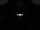 A dark image shows a brightly lit, small rectangular light at the center of a black, indistinct object. Faint green and red hints glimmer on either side, reflecting the excitement of a Big Kids Powerful 24V Speedster Drifting Go-Kart.