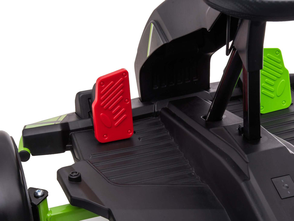 Close-up shot of a Big Kids Powerful 24V Speedster Drifting Go-Karts footrest, showing ribbed textures with matte finish. Features black pedal parts in red and green, with partially visible wheels and backrest hinting at its design.