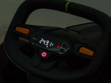 Close-up of the digital display on the steering console of the Big Kids Powerful 24V Speedster Drifting Go-Kart. The screen shows 249.1 V with a red S. Below is a prominent power button flanked by orange buttons, and a green band wraps around the wheels top.