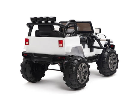 The White 12V Sport Edition Trailcat Big Wheels Kids Ride on Truck with RC boasts a jeep-like open-top design with a spare tire rack, side mirrors, and headlights for realistic play, offering a parental remote control all seen from the rear three-quarter angle.
