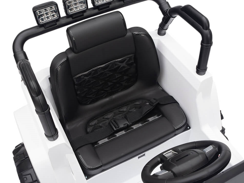 The White 12V Sport Edition Trailcat Big Wheels Kids Ride on Truck with RC features a black seat with harness, steering wheel, and toy car dashboard. Its quilted padding enhances comfort, while the rugged bars and lights accent the exterior for adventure-filled play.