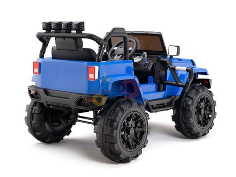 The Blue 12V Sport Edition Trailcat Big Wheels Kids Ride on Truck features a rugged SUV design with large black tires, side mirrors, and a steering wheel. It includes black roll bars and rear lights for an off-road look, displayed diagonally to highlight its side and rear.