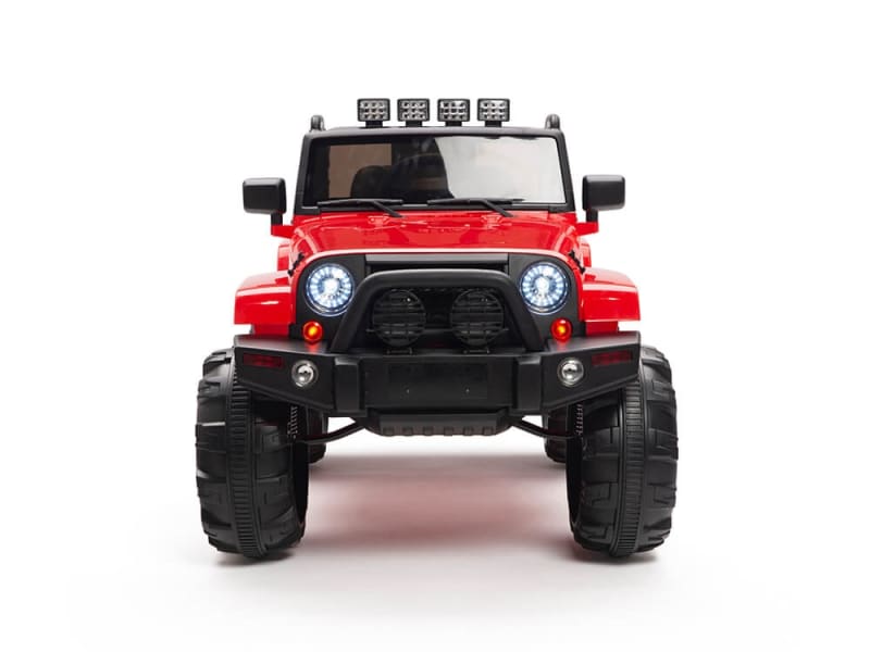 The Red 12V Sport Edition Trailcat Big Wheels Kids Ride on Truck with RC features oversized wheels, four roof spotlights, round headlights, and a black bumper. This rugged jeep stands boldly against a white background, perfect for adventurous playtime.