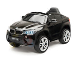 The Limited Licensed BMW X6M 12v Kids Ride On Car features a sleek black design, large wheels, realistic grill, illuminating headlights, and child-friendly seat. With high-performance elements and a parental remote control, this miniature marvel enhances playtime significantly.