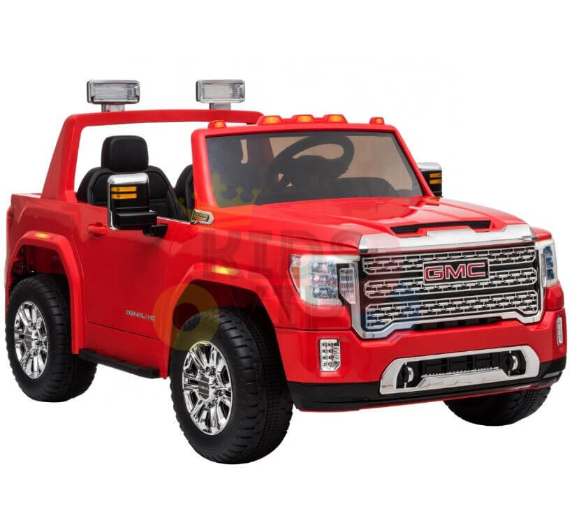 The Red 2x12V Licensed 4WD GMC Sierra Kids Ride On Car with RC features an open top, chrome wheels, detailed dashboard, large headlights, and front grille. It resembles a real truck and is designed for childrens play.