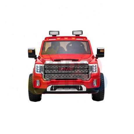 Front view of the Red 2x12V Licensed 4WD GMC Sierra Kids Ride On Car with RC, highlighting its detailed headlights, prominent grille, and side mirrors. It features realistic roof lights and rugged tires for off-road thrills tailored for adventurous kids.