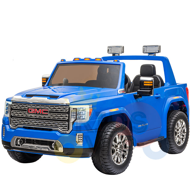 The Blue 2 Seats Officially Licensed 4WD GMC Sierra 2x12V Kids Ride On Car with RC features a detailed grille, headlights, side mirrors, roof lights, and a convertible design. It offers an authentic driving experience with leather seats and a spacious interior for children.