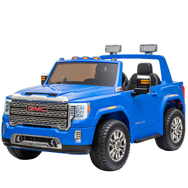 The Enhance Your Ride with 12v/2 Seater GMC Sierra Rear Eva Rubber Wheel is a blue toy car designed for childrens play, resembling a GMC Sierra truck. It features detailed headlights, mirrors, a bold grille with the GMC logo, two seats, a steering wheel, and enhanced traction from its rear EVA rubber wheel.