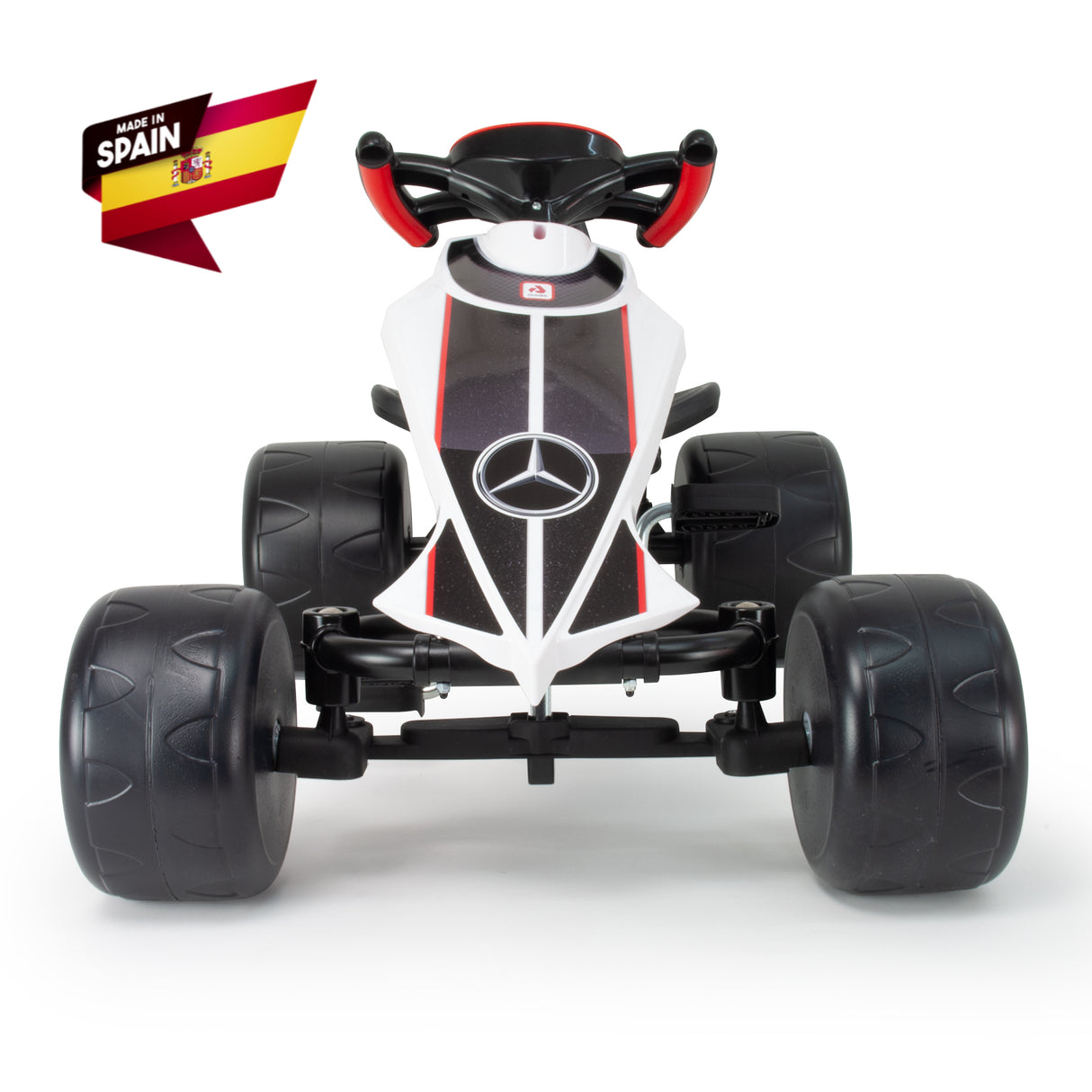 The INJUSA Officially Licensed Mercedes Pedal Go Kart for Kids is a sleek white outdoor toy featuring a black seat, large black wheels, the iconic Mercedes logo on the front, and red handlebar accents. A Made in Spain label with the Spanish flag is on the top left corner.