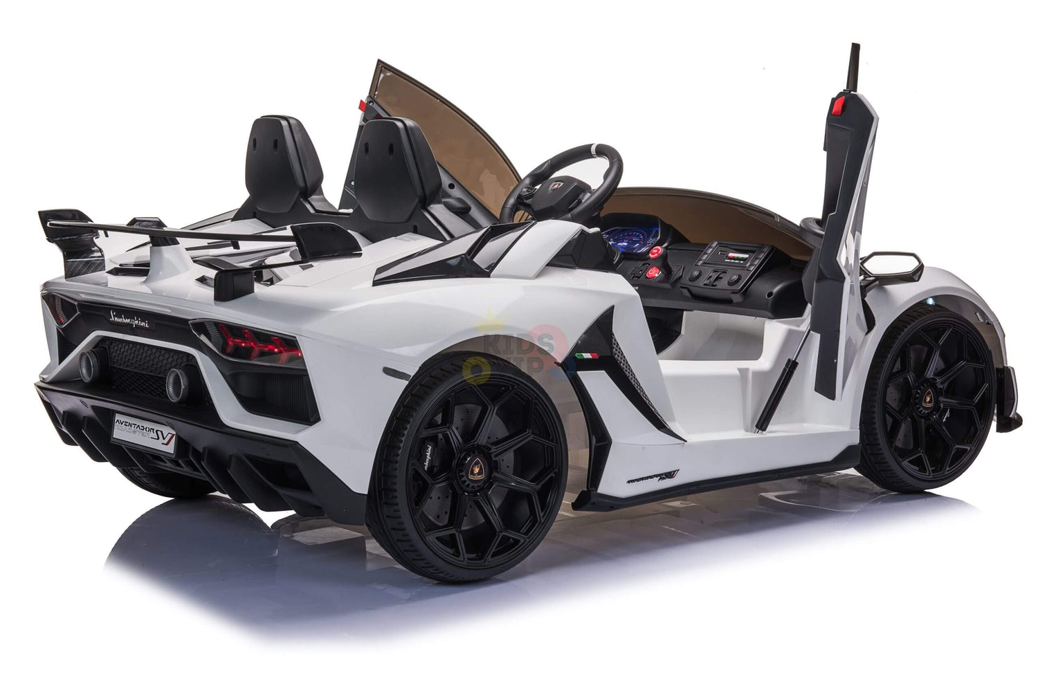 The Upgrade Your Ride with the White 24v Lamborghini SVJ Drifting Kids Ride on Car has open scissor doors, drifting black wheels, a detailed interior, a rear spoiler, and a sleek design for a sporty look. The 24V battery provides an exhilarating experience.