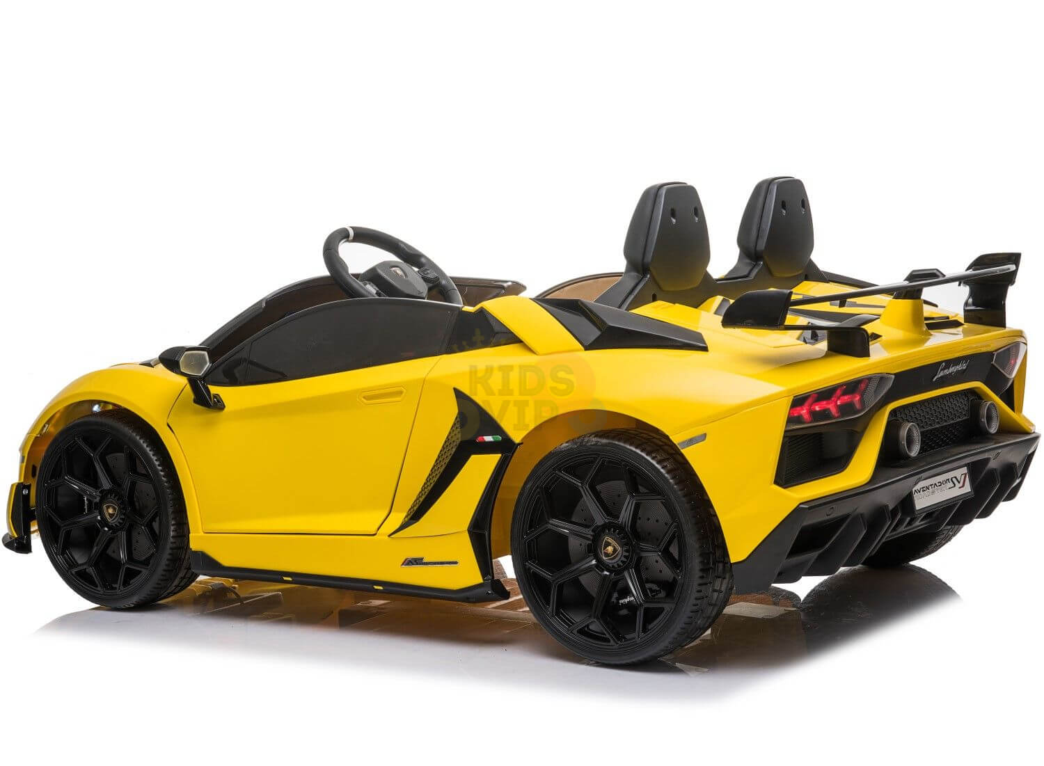 The Yellow 24v Lamborghini SVJ Drifting Kids Ride on Car for children features sleek black accents and luxury design. With two seats, drifting wheels, and a realistic steering wheel, it promises thrilling adventures, showcasing its dynamic side and stylish rear when angled.
