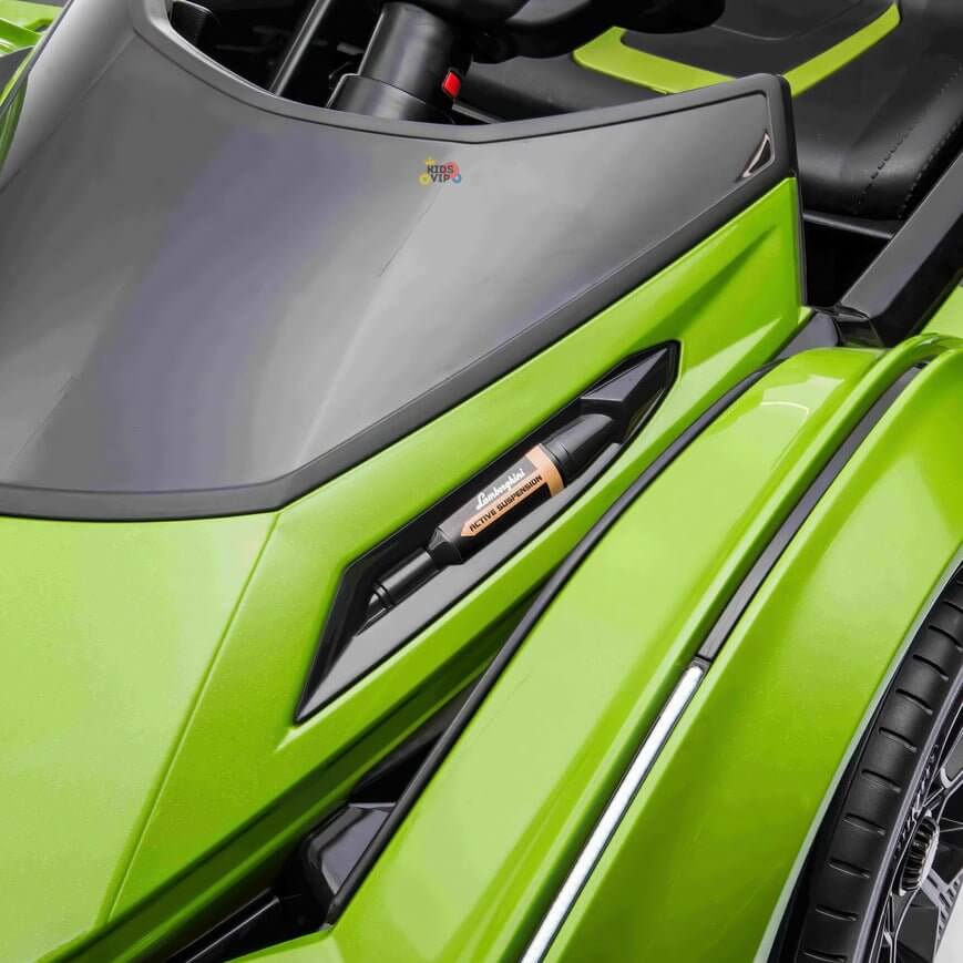 A close-up of the vibrant green fender from the Green 12V Official Lamborghini Vision GT Kids Ride-on Car showcases its sleek modern design. Black detailing contrasts with the bright color, and ADJUST is visible in the logo, adding excitement to this powerful ride.