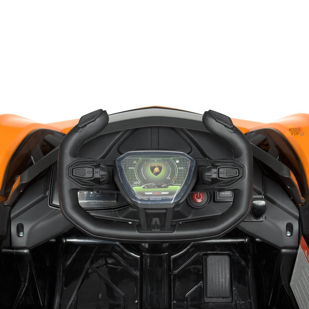 Detailed close-up of a toy cars dashboard featuring a black steering wheel and a digital display. The sleek design echoes Lamborghini Vision GT aesthetics, with an orange exterior indicating its the Orange 12V Official Lamborghini Vision GT Kids Ride on Car.