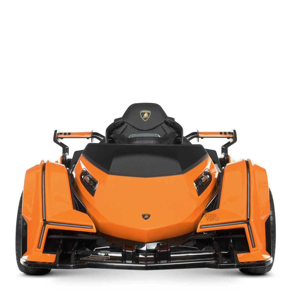 The Orange 12V Official Lamborghini Vision GT Kids Ride-On Car features a sleek design inspired by the iconic sports car, with black accents, a low-profile build, angular body, and two seats, capturing a distinctive modern look.
