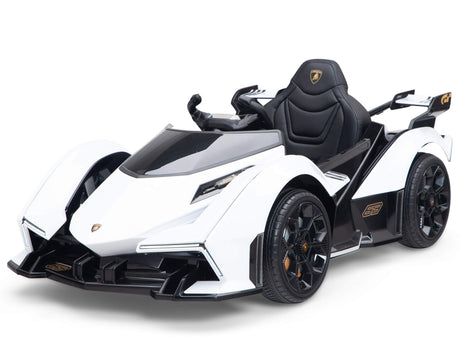 The White 12V Official Lamborghini Vision GT Kids Ride-on Car features a sleek design, black accents, and angular lines. With pedal controls and detailed wheels, it provides an authentic luxury sports car experience.
