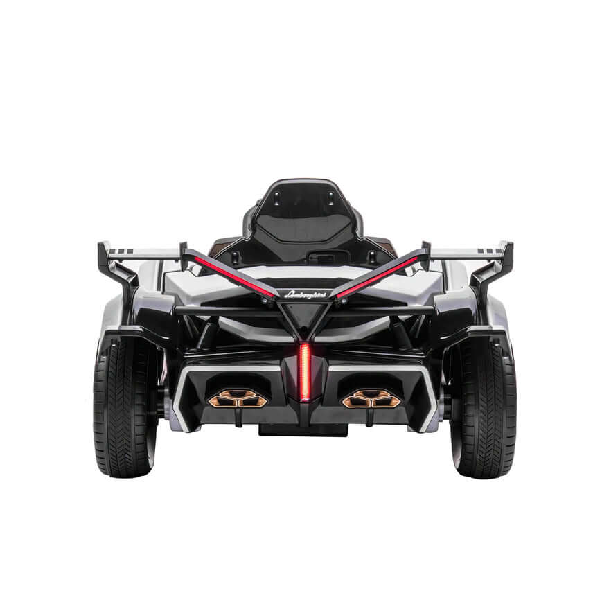 A white official Lamborghini Vision GT kids ride-on car powered by a 12V battery, featuring a sleek sporty design with angular lines, an open cockpit, red accents, gold details at the rear, and large prominent wheels perfect for little racers.