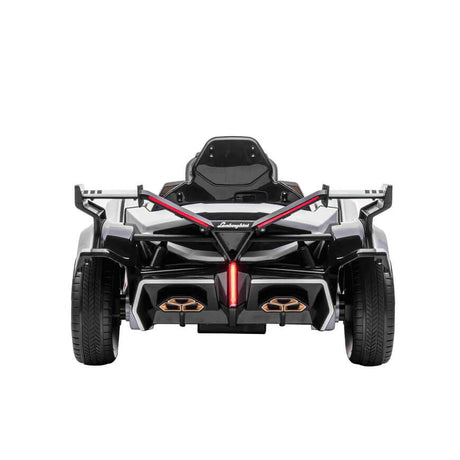 A white official Lamborghini Vision GT kids ride-on car powered by a 12V battery, featuring a sleek sporty design with angular lines, an open cockpit, red accents, gold details at the rear, and large prominent wheels perfect for little racers.
